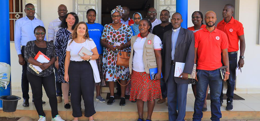 The Head of the Humanitarian Aid Unit at Ministry of Foreign Affairs Belgium – Laura Cogels (2nd left) takes a group photo with partners: URCS, Karitas Uganda, UNHCR at the UNHCR offices in Kyangwali Refugee Settlement.