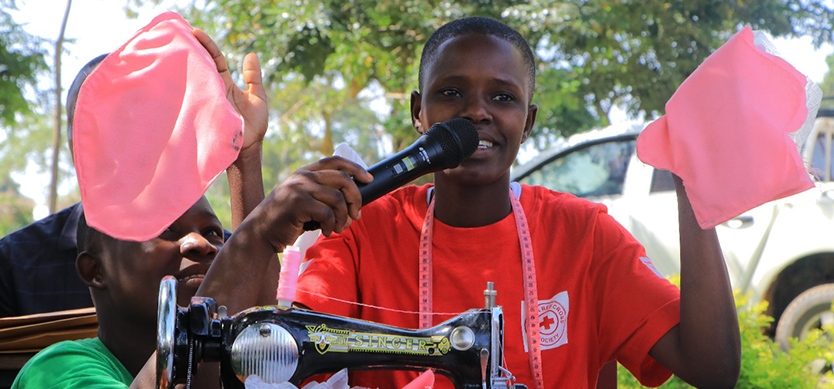 A girl displaying one of her locally made reusable sanitary pad. 