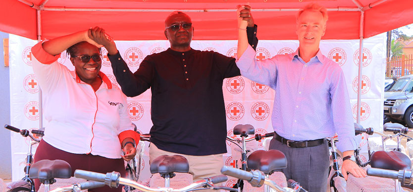 Team from the World Bicycle Relief pose for a photo with the Secretary General Uganda Red Cross