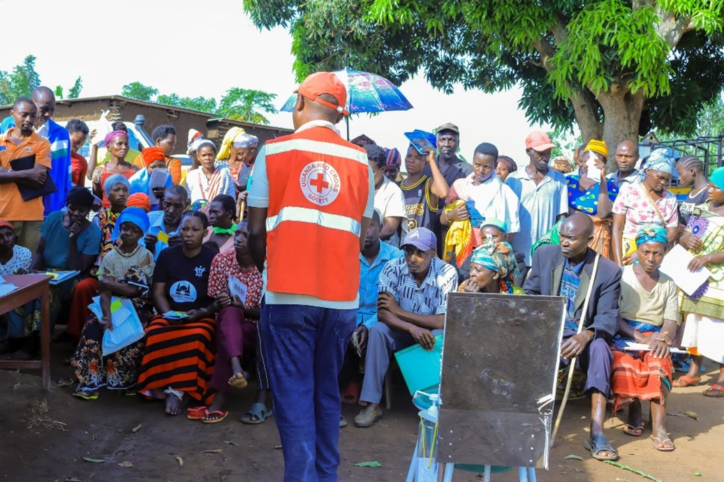 Success Bazibuha Uganda Red Cross Volunteer sensitizing the beneficiaries on how to use the Jengu handwashing facility. 